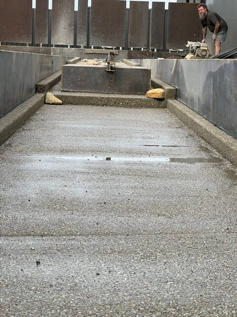 The water-rill base and stepped cascade being finished during construction.