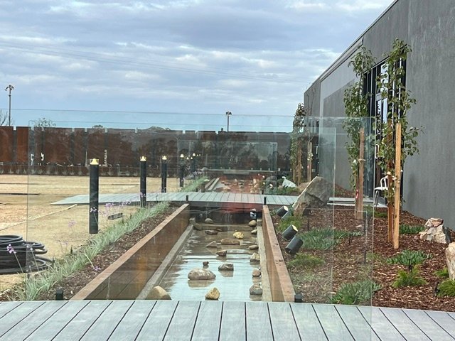 The completed water feature viewed from the adjoining outdoor area.
