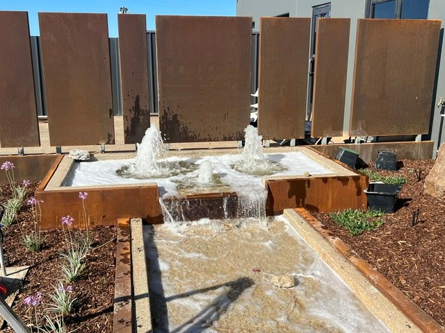 Custom fountain jets and a stepped cascade bring movement and sound to the landscape.