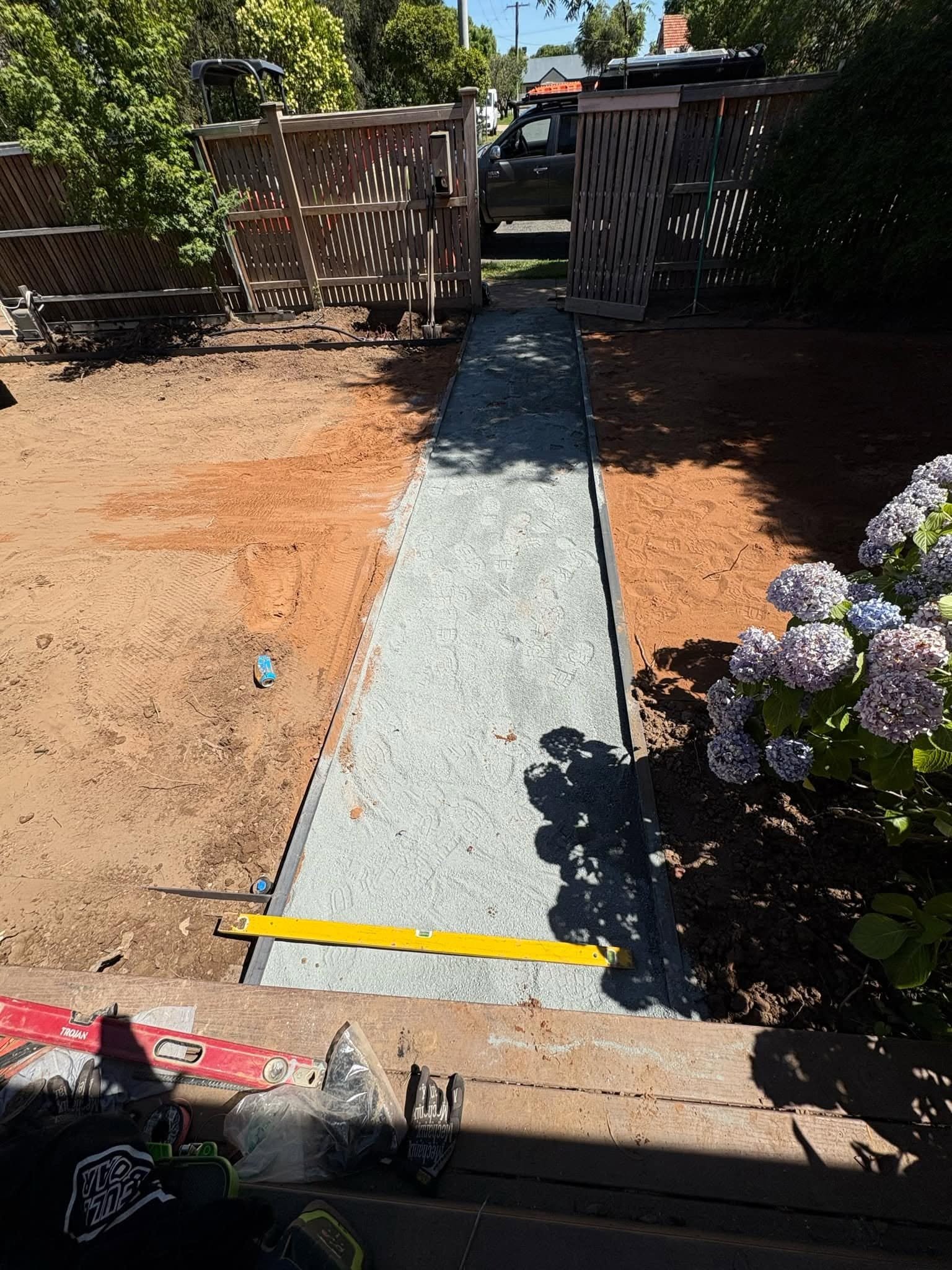 Levelled paving base prepared for a new front entrance path.